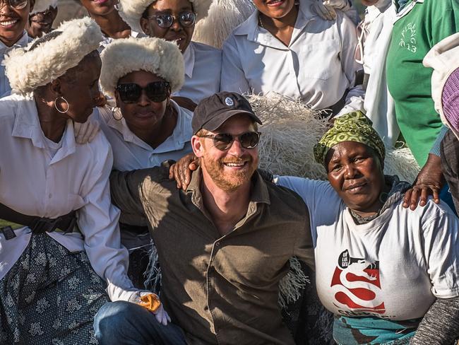 MASERU, LESOTHO - OCTOBER 02: Prince Harry, Duke of Sussex poses for a photo with members of the community during a visit to Matlameng Ã¢â¬â Ha Mahlehle in the Leribe region with Sentebale to meet with the community and see the climate resilience project in action on October 2, 2024 in Leribe, Lesotho. Joining the visit, alongside the Co-Founding Patrons Prince Harry, The Duke of Sussex, and Prince Seeiso of Lesotho, and Board Chair Dr. Sophie Chandauka MBE were a group of innovative international funders and business leaders interested in the Southern African region. (Photo by Brian Otieno/Getty Images for Sentebale)