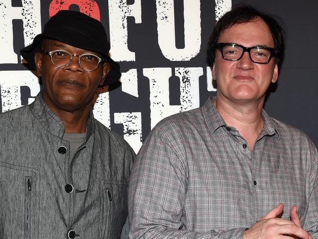 Director Quentin Tarantino (centre), and actors Samuel L. Jackson (left) and Kurt Russell pose for a photograph at the Australian premiere of The Hateful Eight in Sydney on Wednesday, Jan. 13, 2016. (AAP Image/Paul Miller) NO ARCHIVING