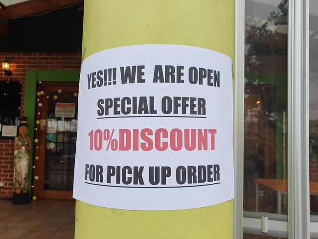 Discount for pick up order sign at Yum Yai Thai on Henley Beach Road, Torrensville. Photo: Greg Barila