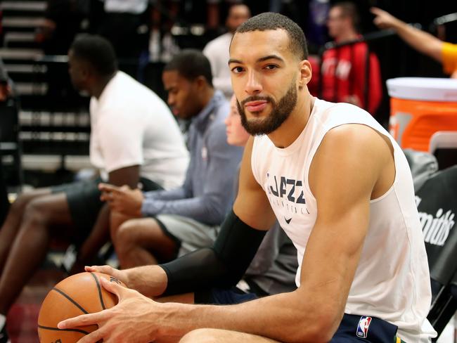 In this file photo taken on December 04, 2019 Utah Jazz center Rudy Gobert cools down after warm ups before a NBA game against Los Angeles Lakers in Salt Lake City, Utah. - Utah Jazz star Rudy Gobert, who apologized for his careless actions before he was diagnosed with novel coronavirus, has pledged to donate more than half a million dollars to health services and arena workers affected by the pandemic. More than half the money will go towards COVID-19 related social service programs in Utah, Oklahoma City and the French health care system, the NBA's Jazz said in a statement on March 14, 2020. (Photo by GEORGE FREY / AFP)