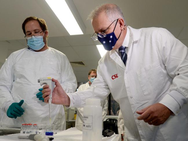 Prime Minister Scott Morrison meets CSL staff working on the COVID vaccine while he tours the company's facility in Melbourne. Picture: NCA NewsWire / Andrew Henshaw