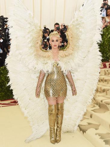 Katy Perry looks angelic in a gold Versace dress and wings. Picture: Getty