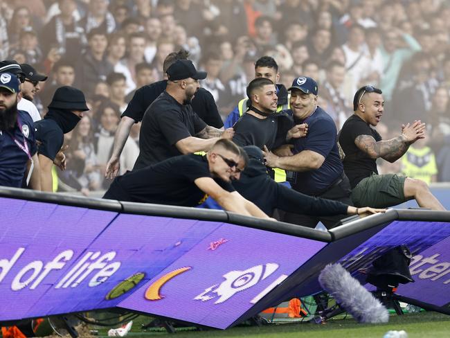 *APAC Sports Pictures of the Week - 2022, December 19* - MELBOURNE, AUSTRALIA - DECEMBER 17: Fans storm the pitch in protest during the round eight A-League Men's match between Melbourne City and Melbourne Victory at AAMI Park, on December 17, 2022, in Melbourne, Australia. (Photo by Darrian Traynor/Getty Images)