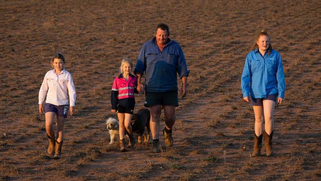 Chris Brennan. Mixed Farmer with daughters Matilda (13) Isabella (11) and Pippa (7) Chis is a mixed farmer producing Cattle, Oats, Wheat on his property in Trangie. Picture Renee Nowytarger