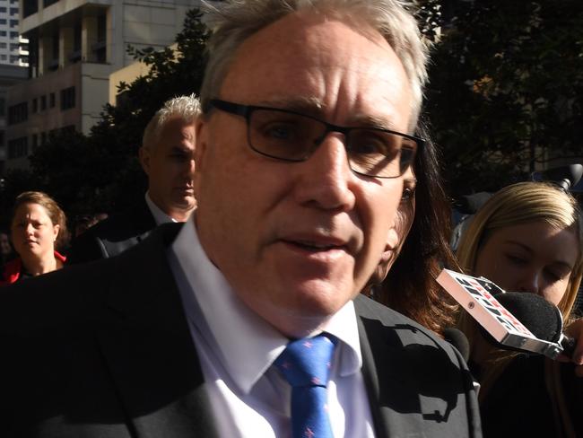 Australian Tax Office Deputy Commissioner Michael Cranston leaves the Downing Centre Courts in Sydney, Tuesday, June 13, 2017. Senior tax office official Michael Cranston has faced a NSW court over an unprecedented white-collar fraud scandal linked to his son and daughter. (AAP Image/Dean Lewins) NO ARCHIVING