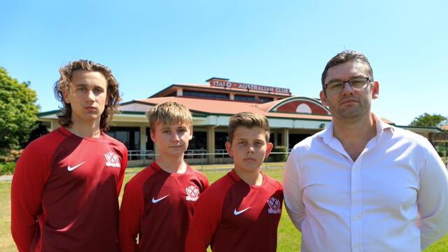 Martin Calvert (right) chair of the proposed Queensland Football School with students.