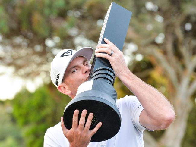 Brendan Steele celebrates with the winner's trophy after the final round of LIV Golf Adelaide at the Grange Golf Club on Sunday. Picture: Brenton Edwards/AFP