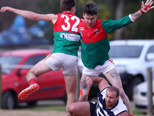 Chelsea player Curtis Bywater is under pressure from Pines players.