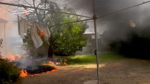 Seaton house fire where an elderly woman was rescued by some tradies . Picture: 7NEWS