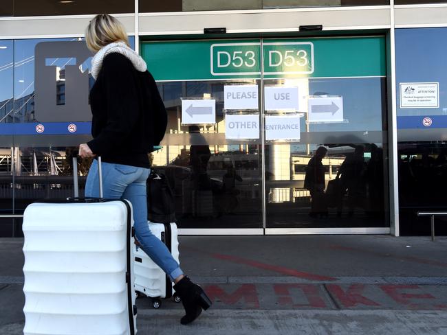 Some entrance doors at the Qantas domestic terminal in Melbourne have been closed off. Picture: Nicole Garmston