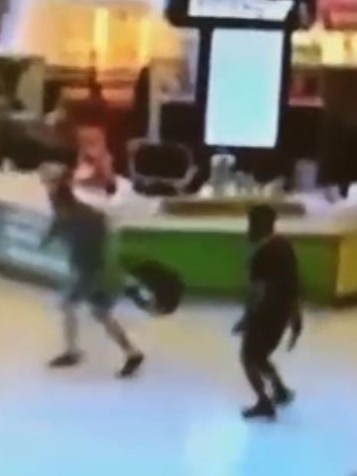 Shopper flees the attacker.