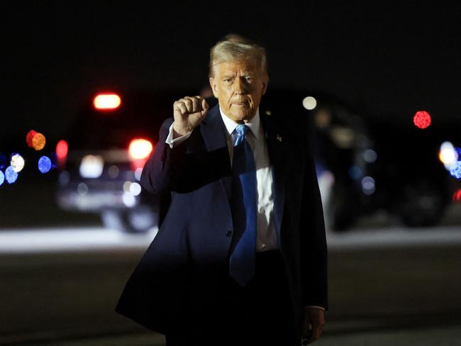 U.S. President Donald Trump pumps his fist upon his arrival in West Palm Beach, Florida, U.S., January 31, 2025. REUTERS/Kevin Lamarque