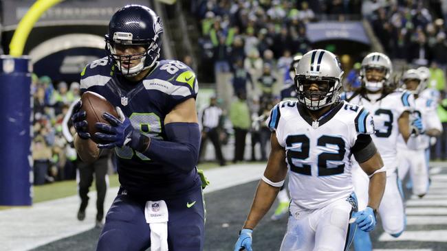 Seattle Seahawks' Jimmy Graham, left, runs for a touchdown.