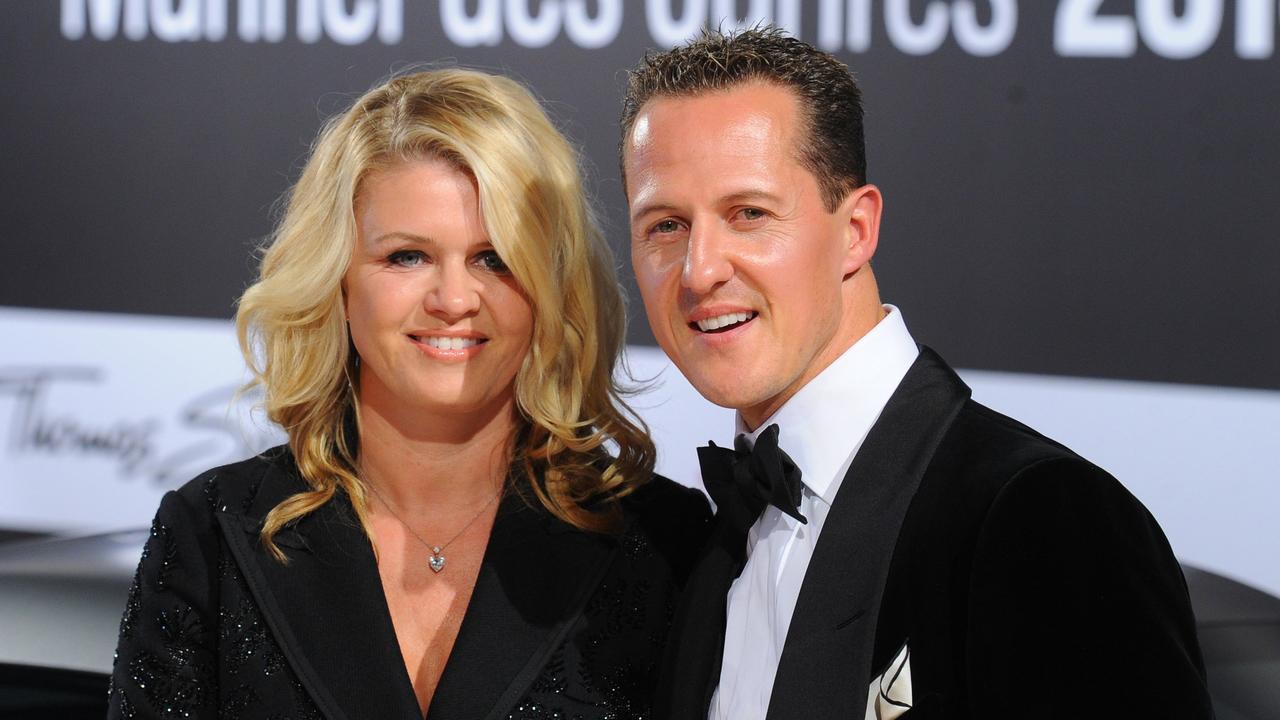 Formula-One driver Michael Schumacher and his wife Corinna. AFP PHOTO / JENS KALAENE.