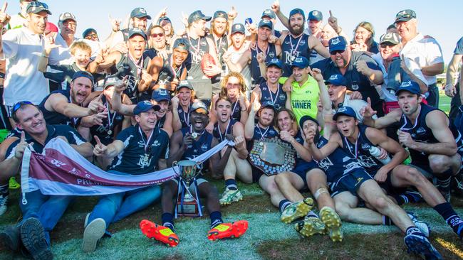 Trevor Mitton (second from left) celebrates the 2014 SFL premiership with Noarlunga. Mitton will look to dismantle the Shoes for the first time this Saturday as coach of Aldinga. Picture: Jeff Wray Photography