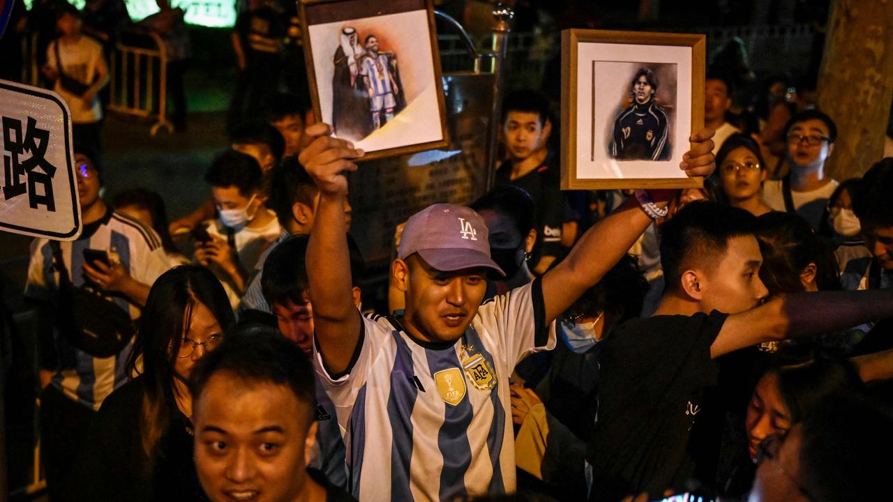 Chinese fans have been gathering outside hotels in Beijing trying to catch a glimpse of Lionel Messi. Picture: Jade GAO / AFP