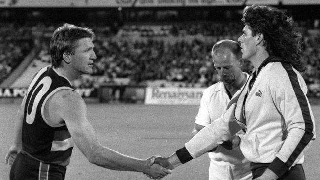 Chris McDermott shakes hands with Gary Ayres before the Crows’ first official game in 1991.