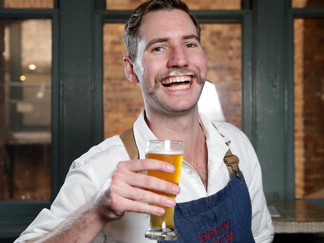 Kieran Flew enjoying a $7.50 middy of beer at the Redoak Boutique Beer Cafe in Sydney. Picture: Jonathan Ng