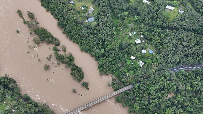 The Barron River water level reached the bridge built over the Kennedy Highway at Kuranda on December 18, 2023. Picture: Craig Crawford