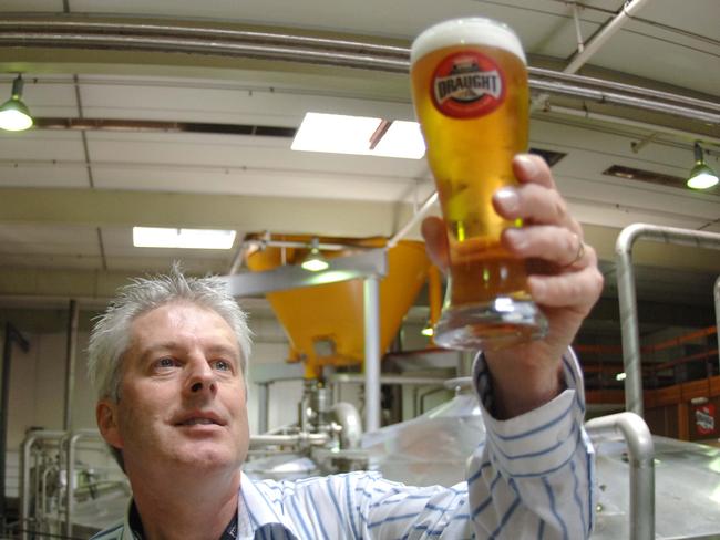 Head brewer Peter David holding schooner of new West End Draught natural beer at Lion Nathan brewery in Adelaide.