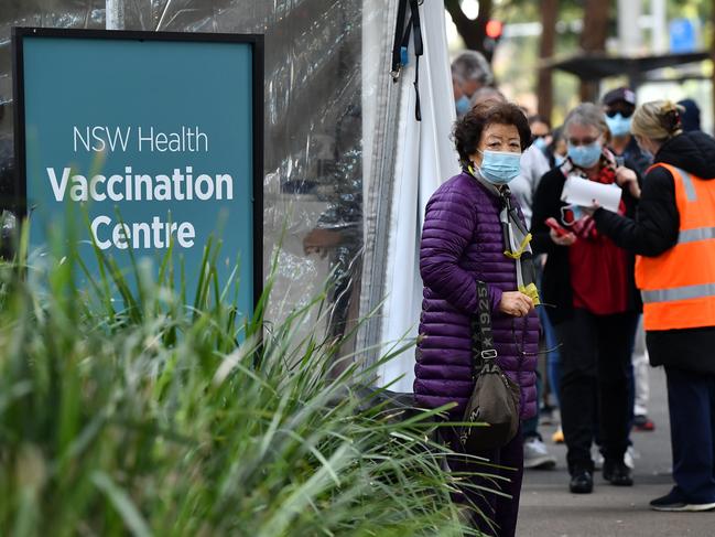 SYDNEY, AUSTRALIA - NewsWire Photos JUNE, 01, 2021: Members of the public queue outside at a mass COVID-19 vaccination hub in Sydney. Picture: NCA NewsWire/Joel Carrett