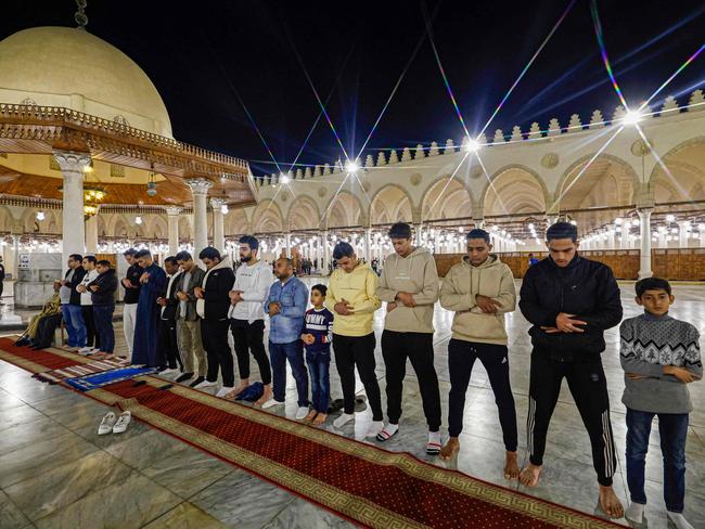 Egyptians perform an evening prayer known as 'Tarawih' on the eve of the Muslim holy fasting month of Ramadan at Cairo's historic mosque of Amr Ibn al-Aas. Picture: AFP