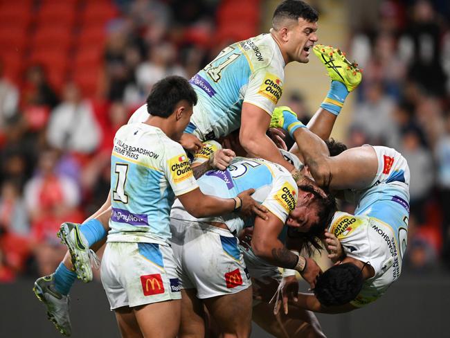 BRISBANE, AUSTRALIA - JULY 28: Klese Haas of the Titans celebrates scoring a try with team mates during the round 21 NRL match between Dolphins and Gold Coast Titans at Suncorp Stadium, on July 28, 2024, in Brisbane, Australia. (Photo by Matt Roberts/Getty Images)