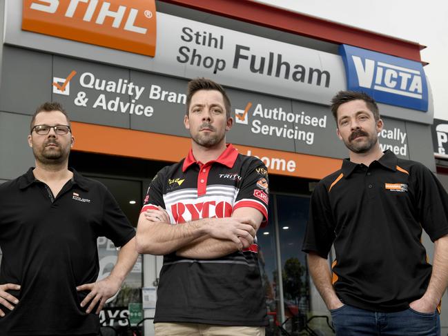 ADELAIDE, AUSTRALIA - NewsWire Photos SEPTEMBER 3, 2021: Supercar racer Craig Dontas (centre) and his family including brother Mark (left) and Troy (right) are taking on Wesfarmers-owned Bunnings in a fight to protect their name. Bunnings has trademarked the name 'Dontas', which has the family upset. They are pictured at Mark's Stihl Shop in Fulham.  Picture: NCA NewsWire / Naomi Jellicoe