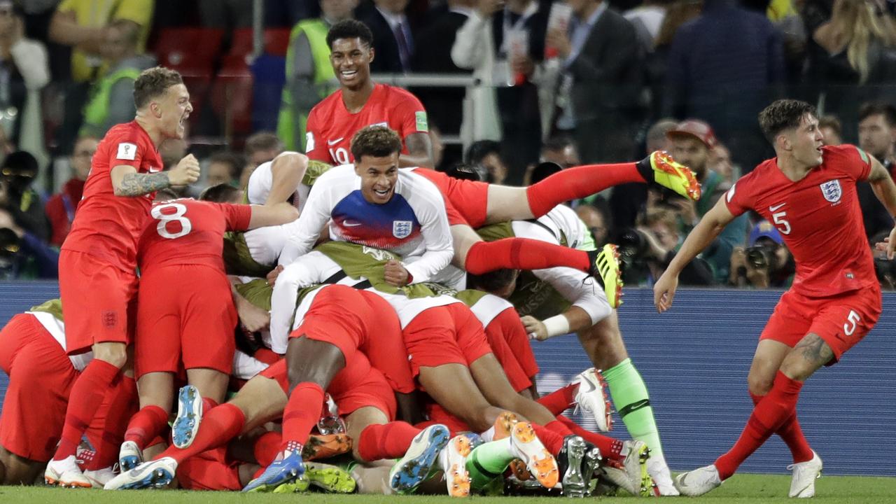 England players celebrate after beating Colombia in a penalty shootout.