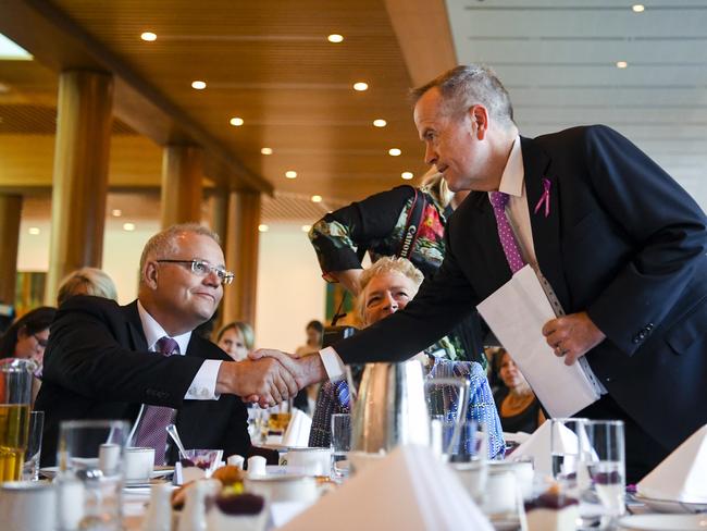 Australian Prime Minister Scott Morrison shakes hands with Opposition Leader Bill Shorten during the International Women's Day breakfast. Picture: AAP