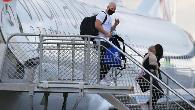 Geelong star Gary Ablett arrives on the Gold Coast with wife Jordan and son Levi Picture Glenn Hampson