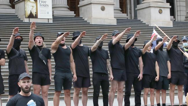 Neo-Nazis in front of the Victorian Parliament on Saturday. Picture: NCA NewsWire / David Crosling