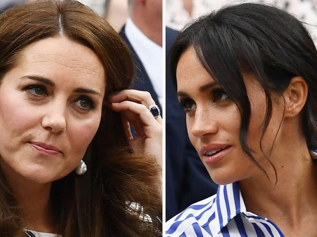 LONDON, ENGLAND - JULY 14:  Catherine, Duchess of Cambridge and Meghan, Duchess of Sussex attend day twelve of the Wimbledon Lawn Tennis Championships at All England Lawn Tennis and Croquet Club on July 14, 2018 in London, England.  (Photo by Clive Mason/Getty Images)