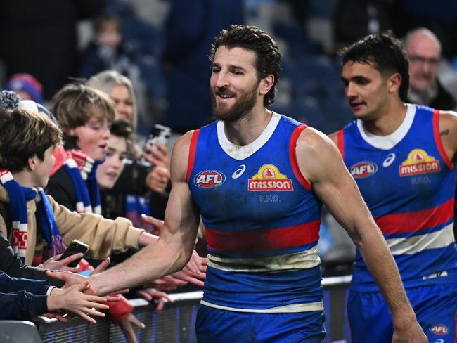 GEELONG, AUSTRALIA - JULY 20: Marcus Bontempelli of the Bulldogs and Jamarra Ugle-Hagan of the Bulldogs greet fans after winning the round 19 AFL match between Geelong Cats and Western Bulldogs at GMHBA Stadium, on July 20, 2024, in Geelong, Australia. (Photo by Daniel Pockett/Getty Images)