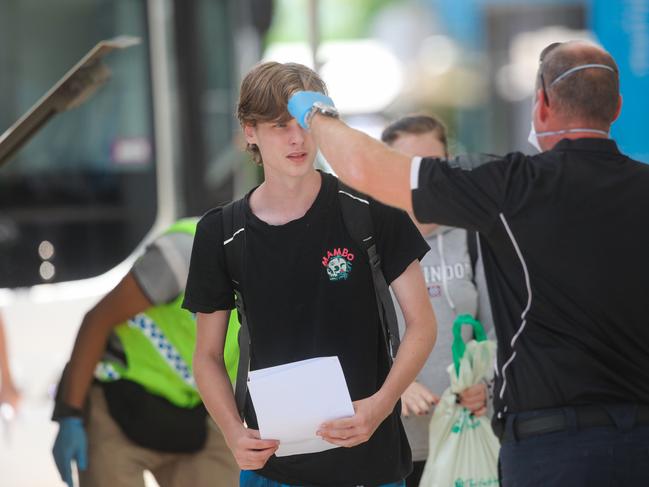 Travellers arrive at Darwin International Airport as all interstate arrivals require 14 days in Quarantine. Picture: GLENN CAMPBELL