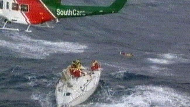 Southcare rescue helicopter hovering over dismasted yacht Sword of Orion on December 28.