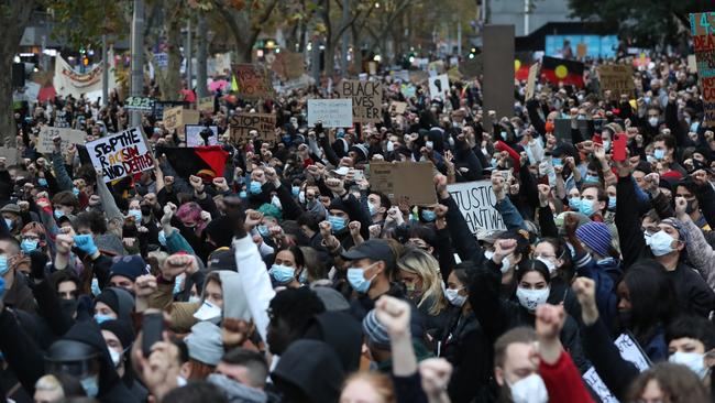 Protesters wore masks as they gathered to protest. Picture: Alex Coppel