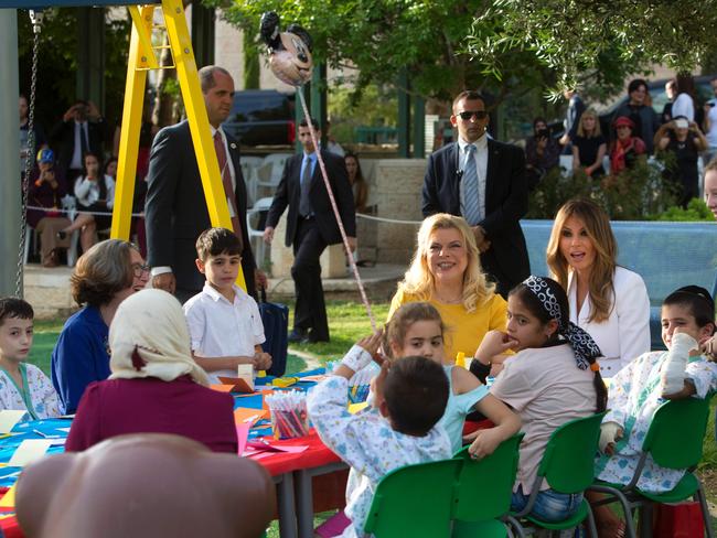 Melania Trump (right) and Sara Netanyahu talk with children during a visit to the Hadassah hospital in Jerusalem. Picture: AFP/Sebastian Scheiner