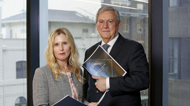 L to R: Commissioner Simone Constant and Chair Joe Longo with the ASIC report into Australia's Evolving Capital markets. Picture: John Appleyard