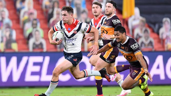 Roosters halfback Kyle Flanagan races away to score at Suncorp Stadium on Thursday night, leaving Brisbane’s Anthony Milford and Darius Boyd in his wake. Picture: Getty Images