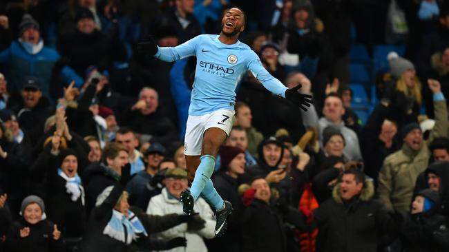 Raheem Sterling of Manchester City celebrates his stunning winner.