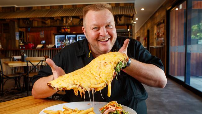 Owner of the Macclesfield Hotel, Justin ‘Yorky’ York with one of their giant schnitzels. Picture Matt Turner.