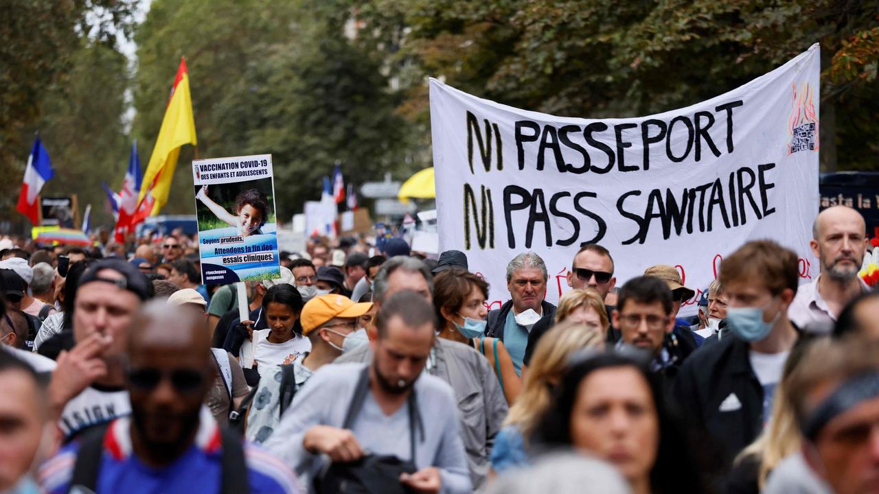 Demonstrators march during a protest against the compulsory Covid-19 vaccination for certain workers, and the mandatory use of the health pass in Paris. Picture: Thomas Samson /AFP