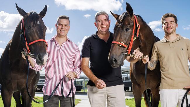 Sunshine Coast trainer Stuart Kendrick with his two sons Nathan and Bayley and brother horses Defiant Spirit and Defiant Boom who are running in the 2yo and 3yo $500,000 races on Saturday. Picture Lachie Millard