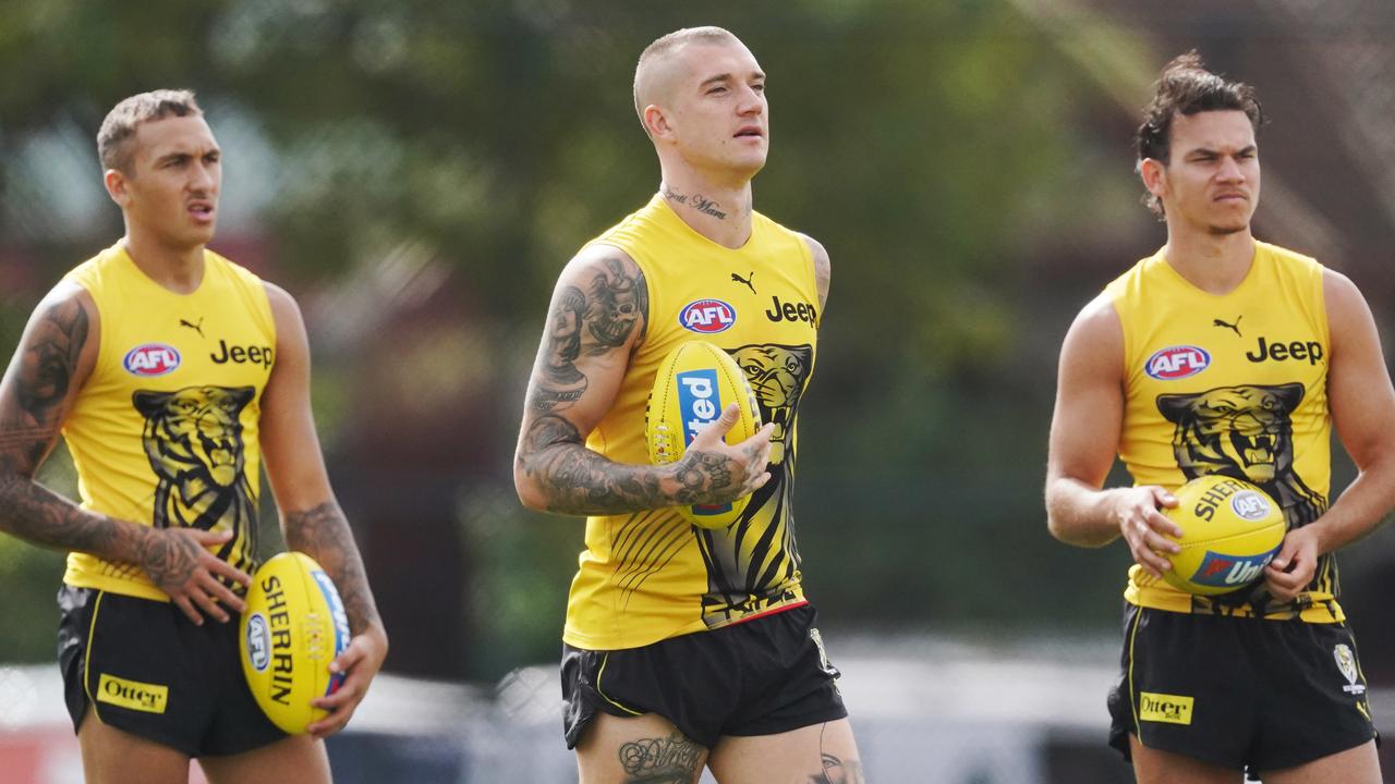 Richmond’s Dustin Martin with teammates at training. (AAP Image/Michael Dodge)