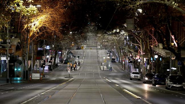 A very quiet Collins Street on the first night Metropolitan Melbourne’s curfew began. Picture: Getty