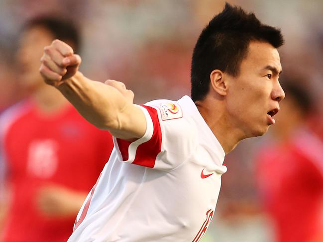 CANBERRA, AUSTRALIA - JANUARY 18: Sun Ke of China celebrates after scoring a goal during the 2015 Asian Cup match between China PR and DPR Korea at Canberra Stadium on January 18, 2015 in Canberra, Australia. (Photo by Mark Nolan/Getty Images)