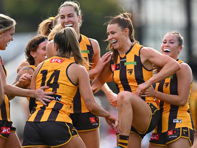 Aileen Gilroy is congratulated by teammates after kicking a goal during against Collingwood. Picture: Quinn Rooney/Getty Images.