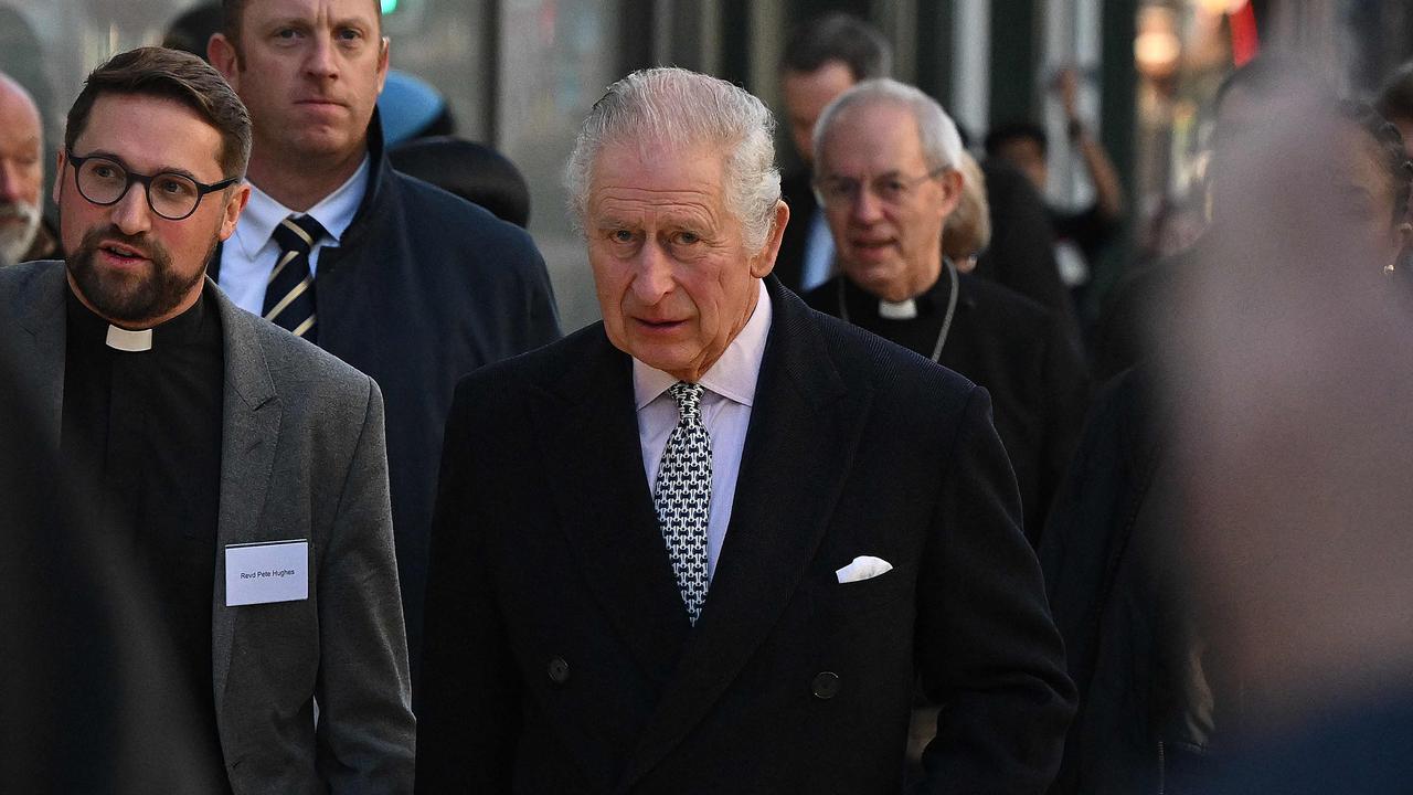 Britain's King Charles III walks to attend an Advent Service at The Ethiopian Christian Fellowship Church, in London on December 8, 2022. (Photo by JUSTIN TALLIS / POOL / AFP)