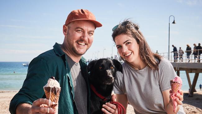 Richard and Grace Fuller eating ice cream with their dog, Penny, 3 in Glenelg. Picture: Matt Loxton